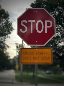 Photo of a blurry stop sign.