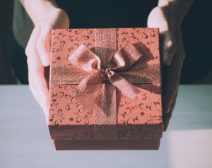 Photo of a brown gift box with bow by Porapak Apichodilok from Pexels
